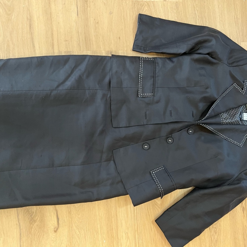 Black crop jacket with matching dress with poki dot sat tan lining.